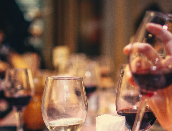 Group of people around a table talking in a restaurant